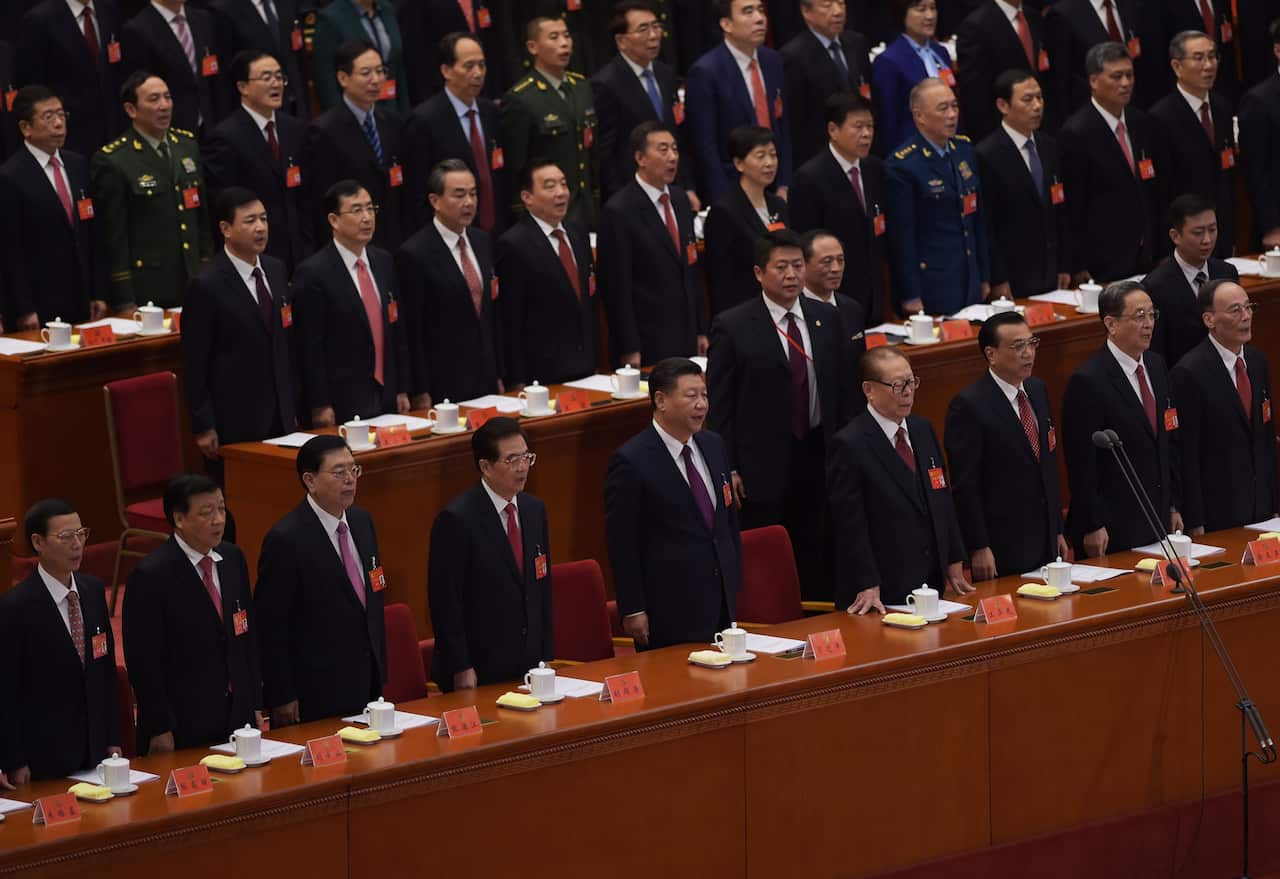 Xi Jinping (C) sings the National Anthem with Chinese leaders during the opening of the 19th Communist Party Congress at the Great Hall of the People in Beijing