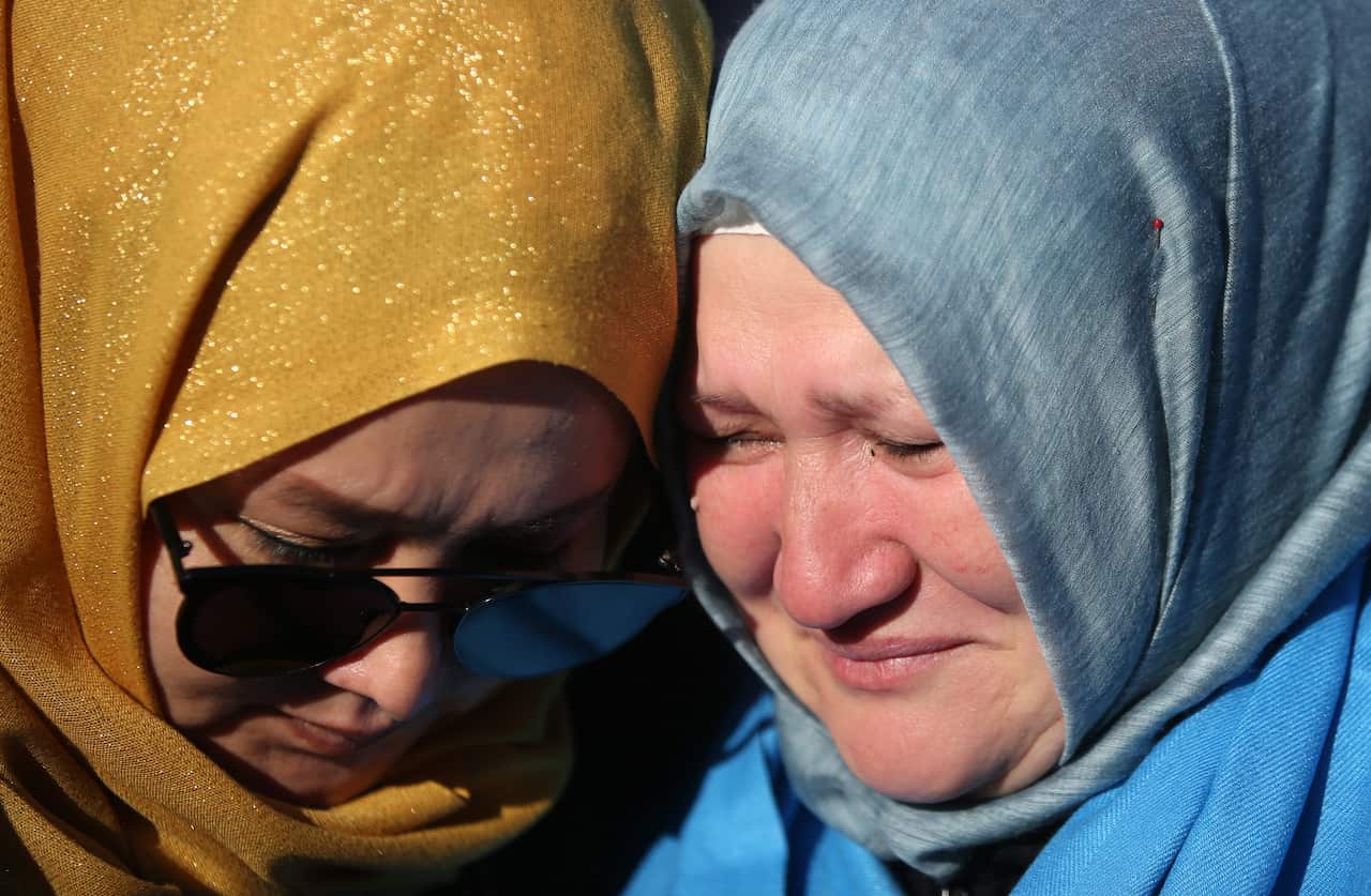 Uyghur women cry during a protest against China in Istanbul, Turkey.