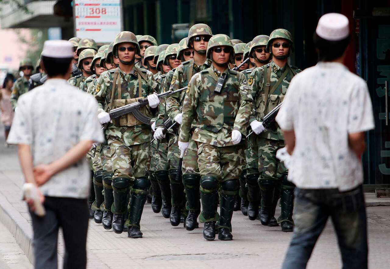Chinese paramilitary police patrol in the aftermath of riots in Urumqi, in 2009. The riots set in motion the harsh measures and detainment of Uighurs.