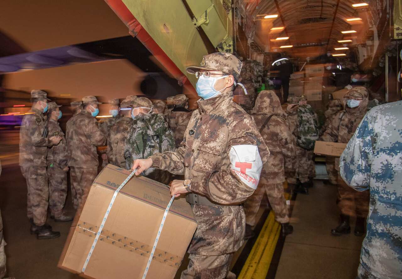 Chinese troops  arrive with medical supplies at Wuhan Tianhe Airport in Wuhan. Hundreds of military personnel have deployed to assist the city. 