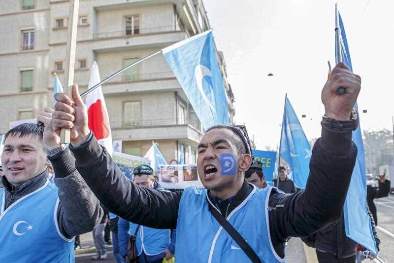 Uyghurs people demonstrate against China during the Universal Periodic Review (UPR) of China by the Human Rights Council, outside the UN building in Geneva.