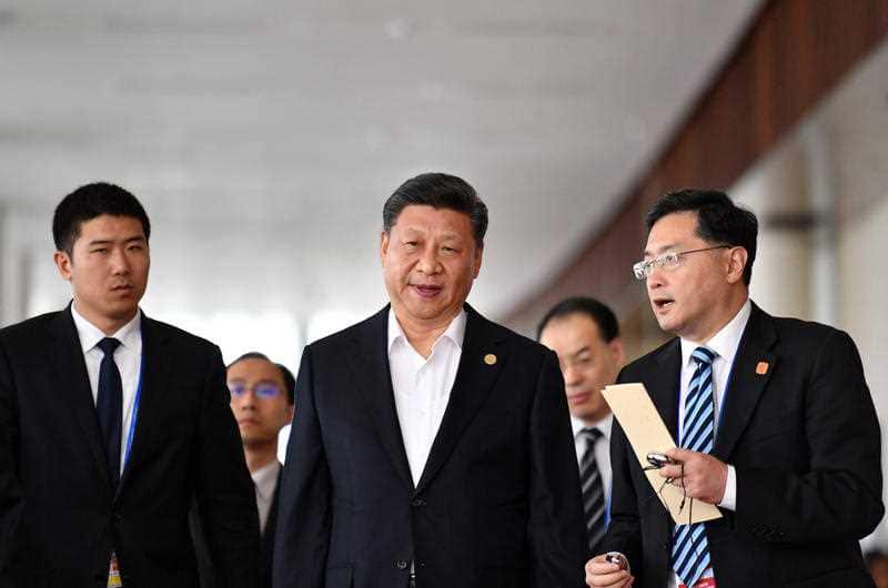 China's President Xi Jinping (C) leaves an APEC meeting. There's been tense scenes this week as China and the US face off at the summit.