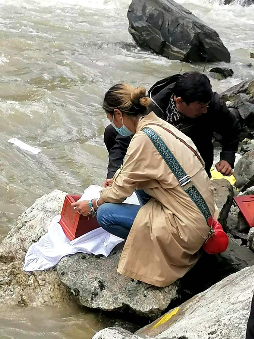 In an undated photo via Dolma, Lhamo's ashes are scattered in a river near the village where she lived. (Via Dolma via The New York Times)