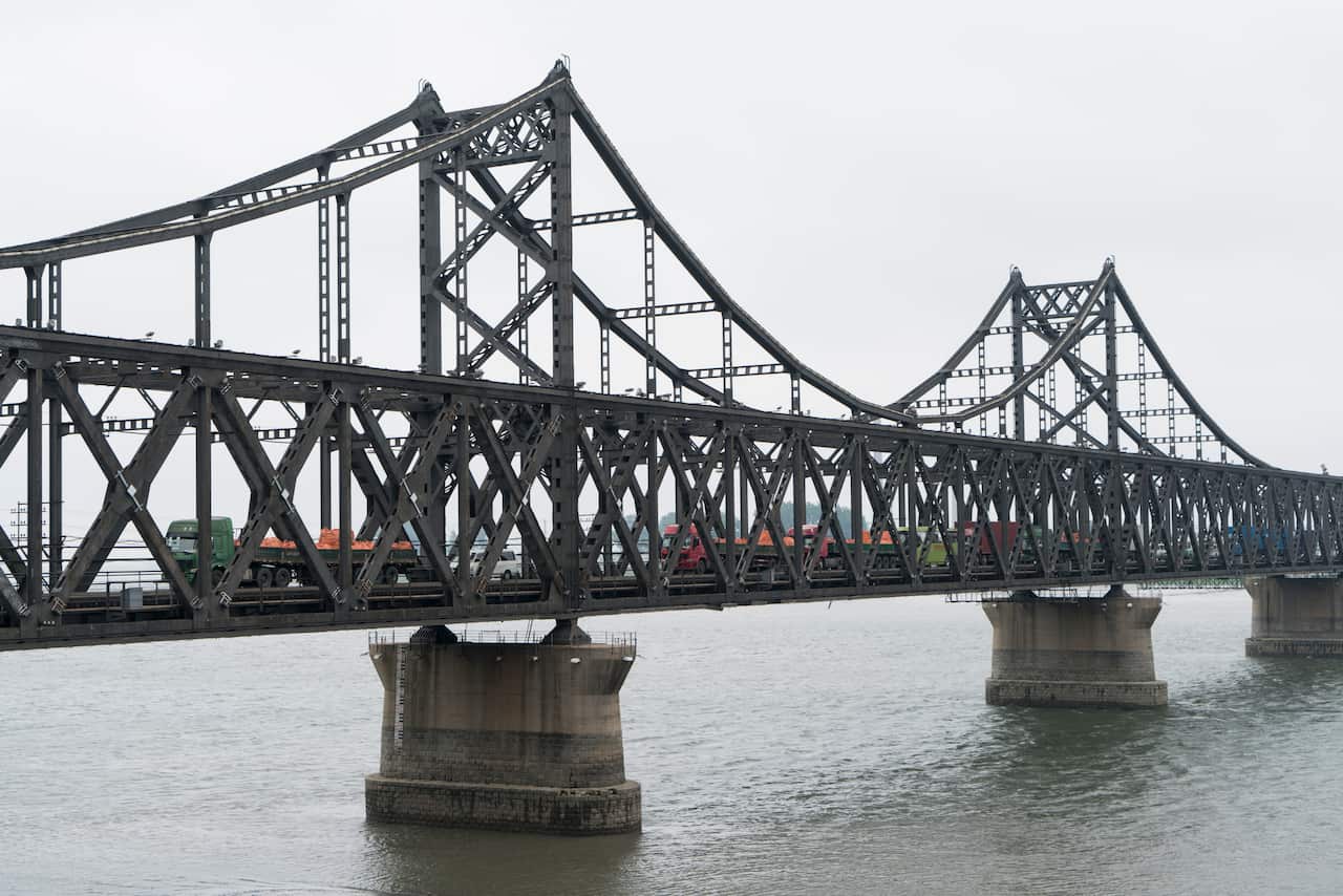 Trucks loaded with North Korean goods waiting to enter China through the Sino-Korean Friendship Bridge in Dandong, China.