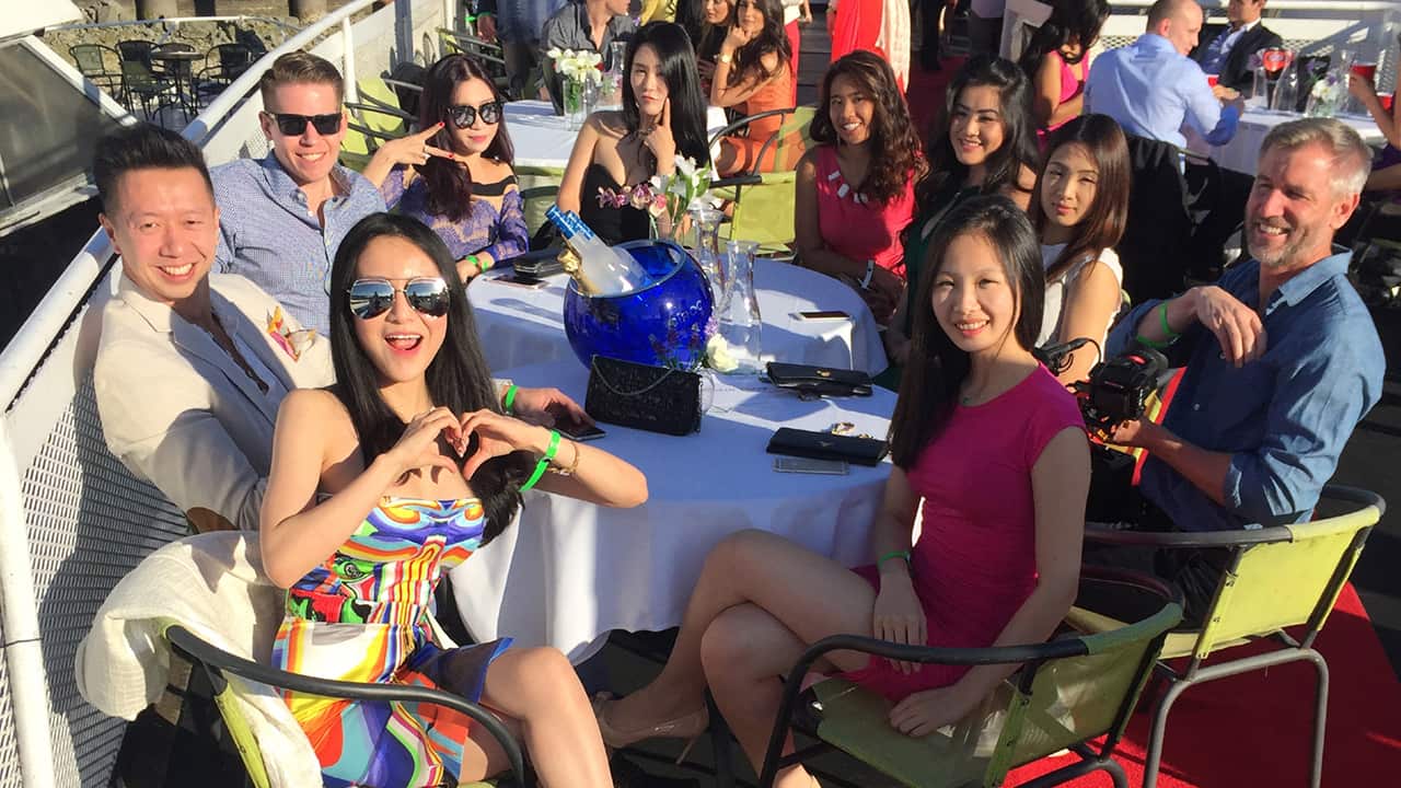 Aaron (right) enjoys drinks in style with the Ultra Rich Asian Girls and their entourage.