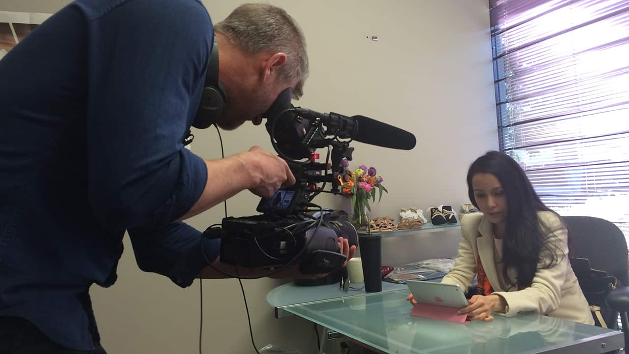 Aaron films Chelsea Jiang at work, running an online store for new mothers.