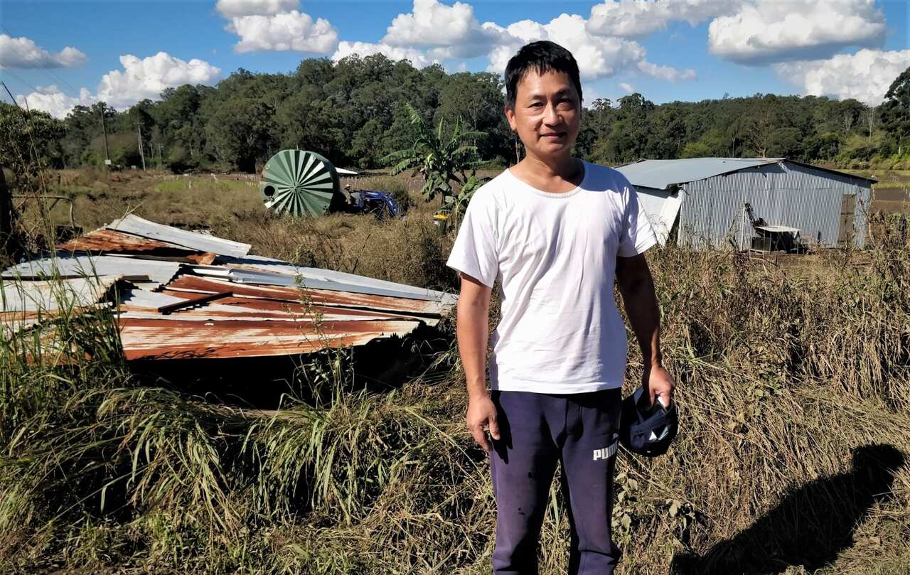 Shi Zhuang at his flood affected farm in Sackville, NSW.
