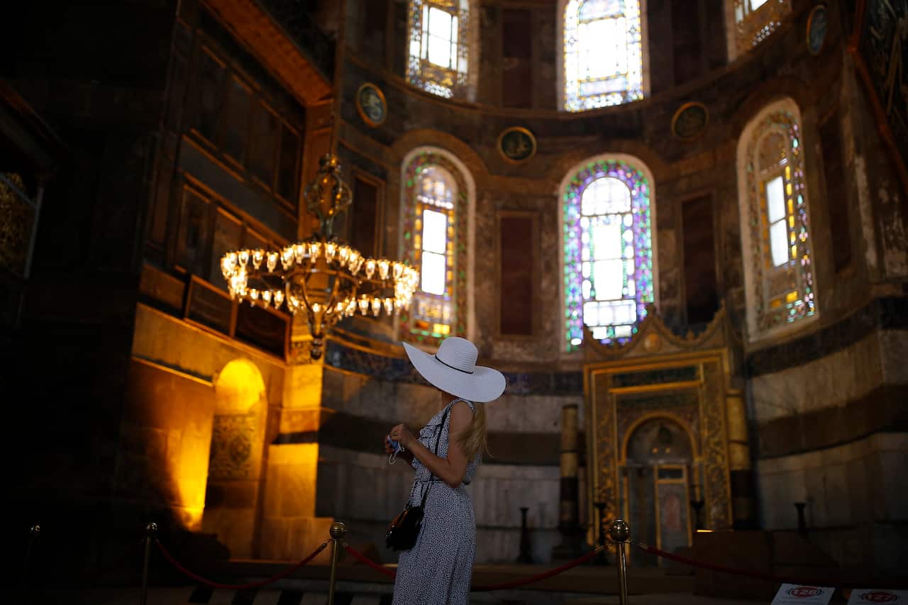 A woman visits the Byzantine-era Hagia Sophia, an UNESCO World Heritage site.
