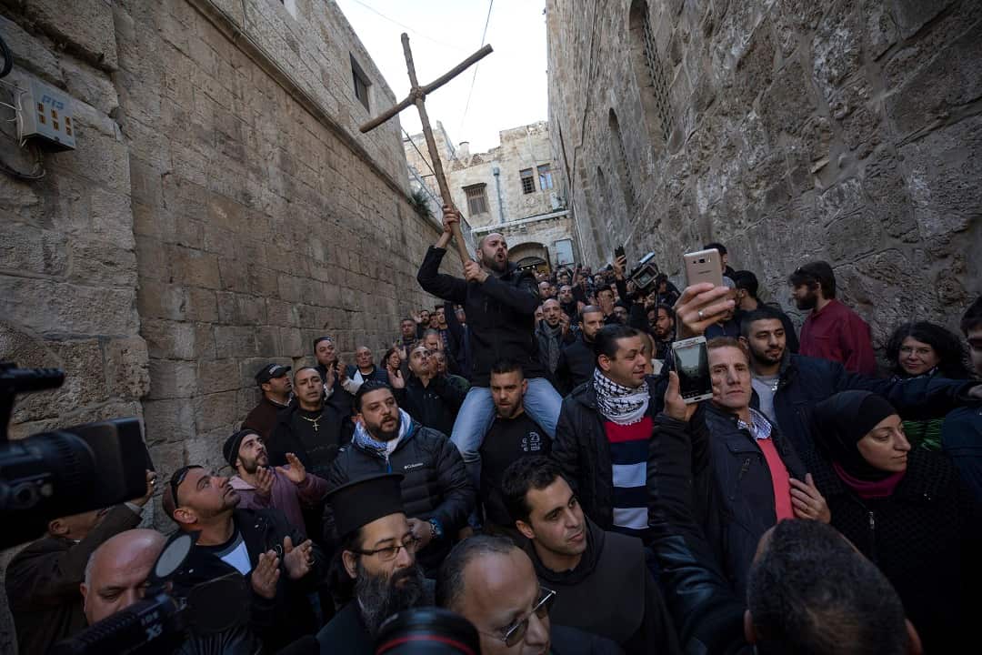 Christian worshipper protest next to the closed doors of the Church of the Holy Sepulchre in the Old City quarter of Jerusalem.