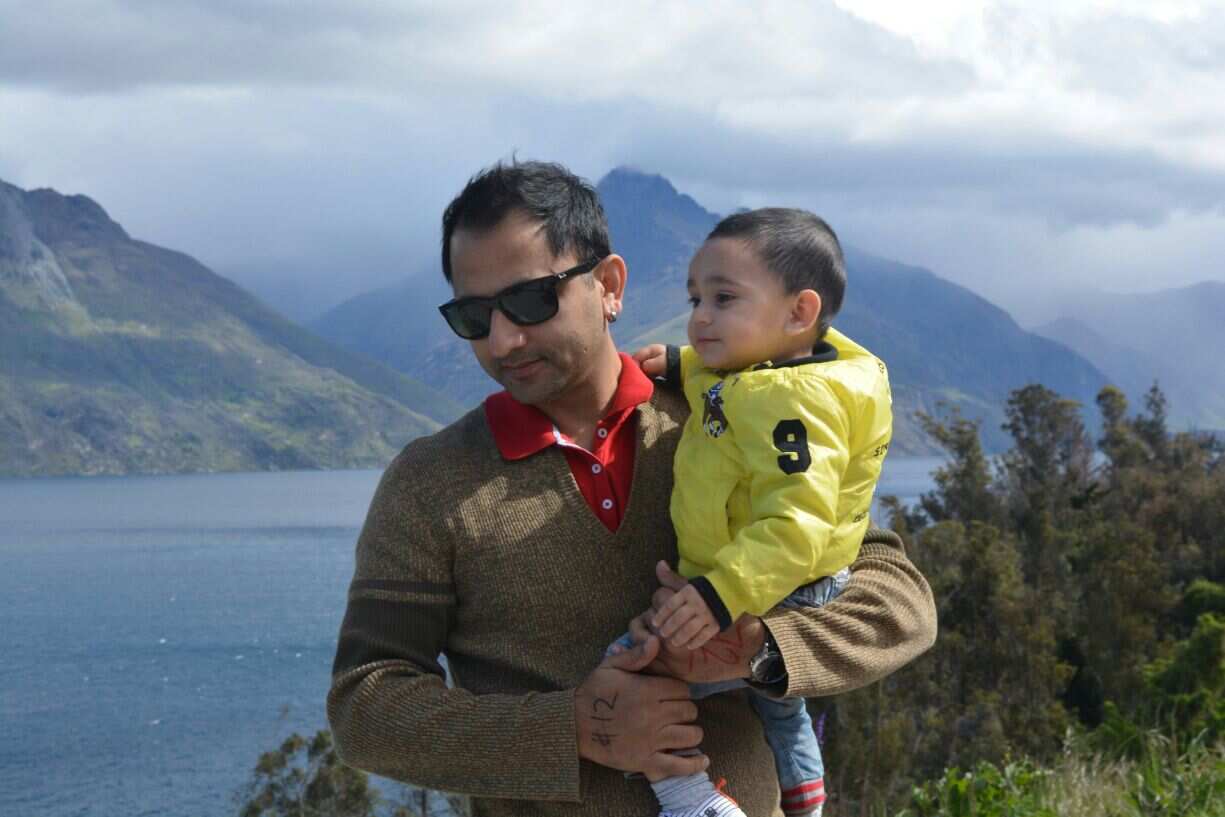 Khizer Baloch with his son