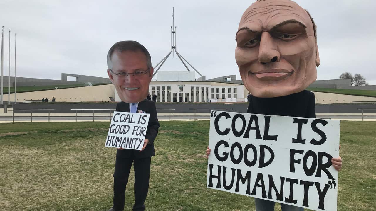 A supplied photograph of protestors mimicking various federal politicians outside Parliament House.