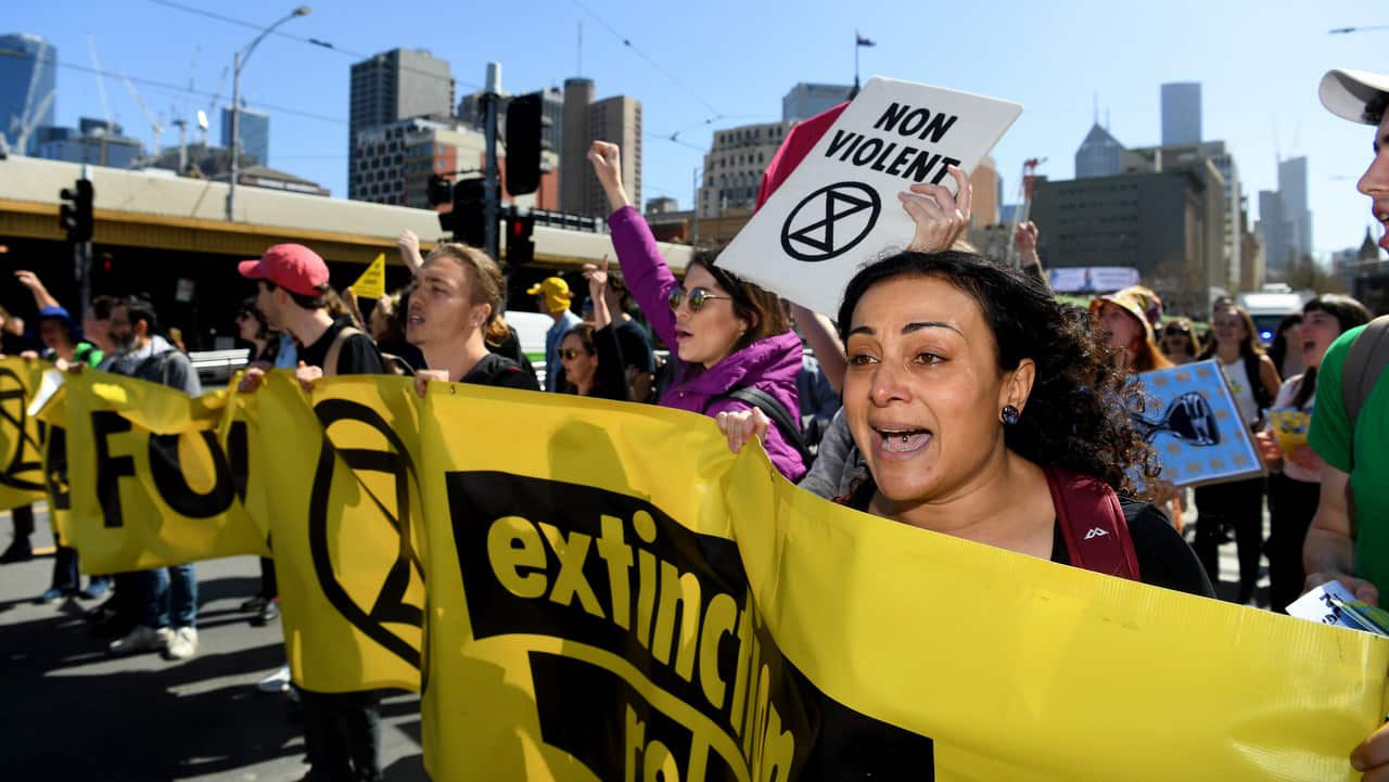 Extinction Rebellion activists have blocked Princess Bridge, calling on the Australian government to step up efforts to combat climate change. 