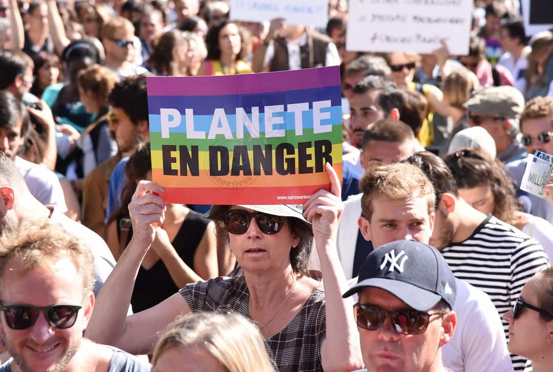 People in Paris join tens of thousands across the world who marched calling for action on climate change. 