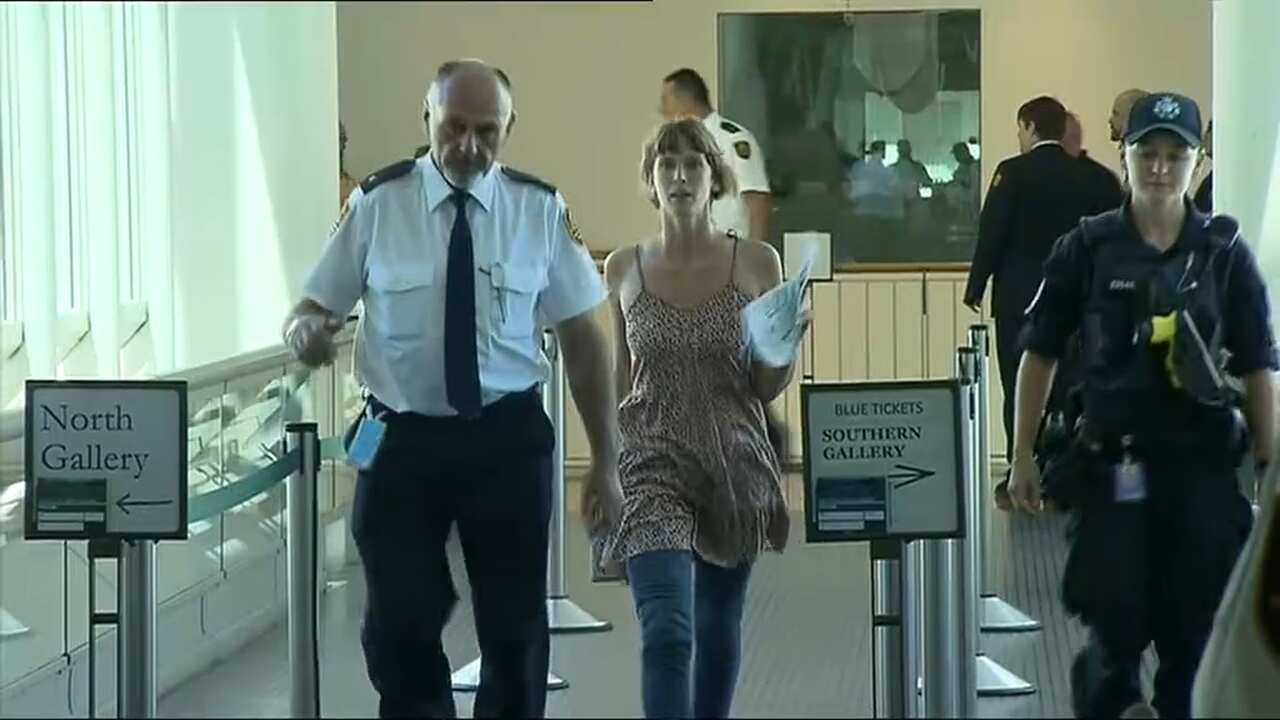 Chanting and yelling "record breaking droughts and bushfires", the protesters disrupted question time until they were removed by security.