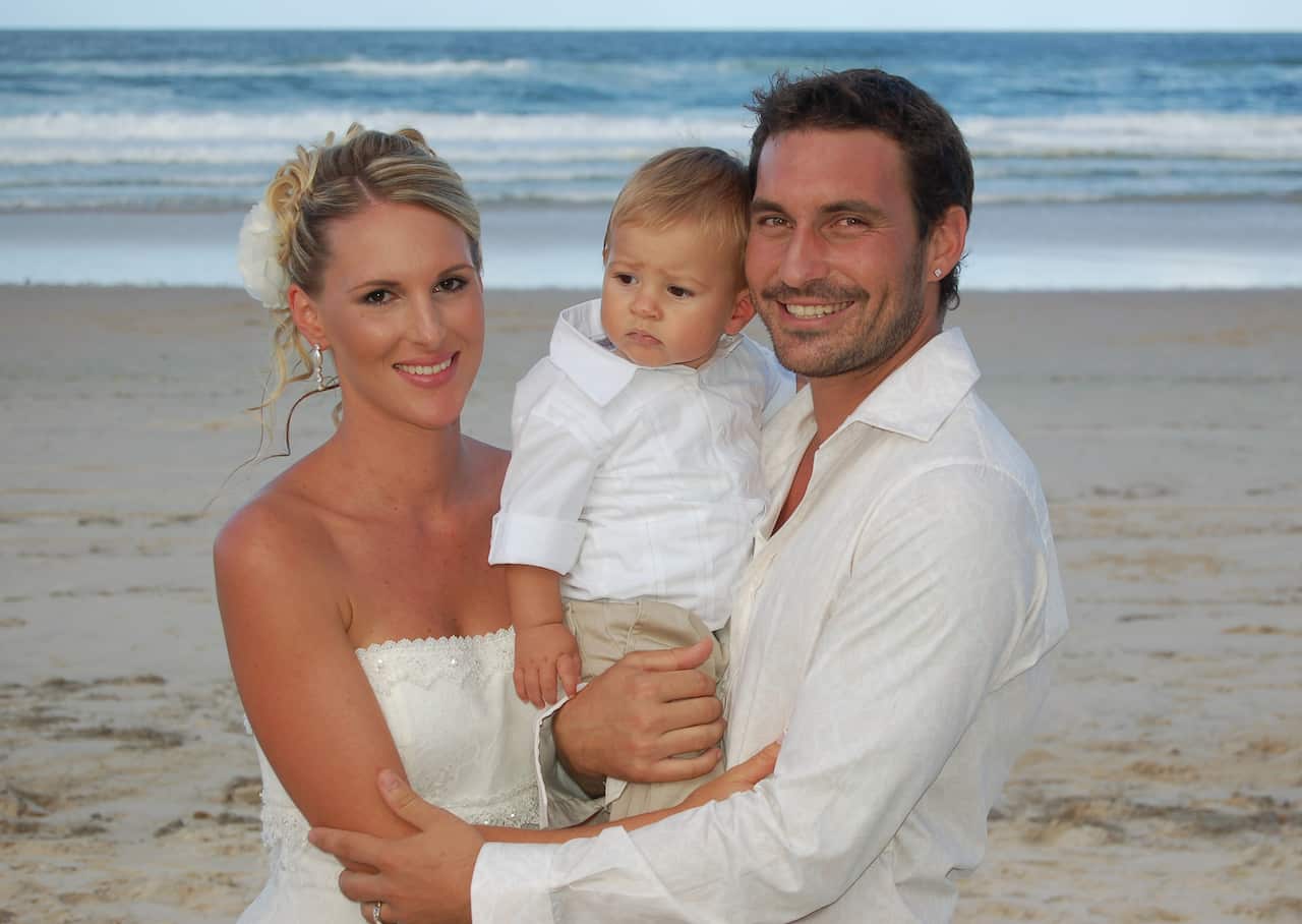 Clinton (right) with his wife Lozen on their wedding day.