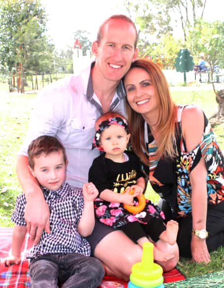 Clinton Hill with his current wife Michelle and their two children.  