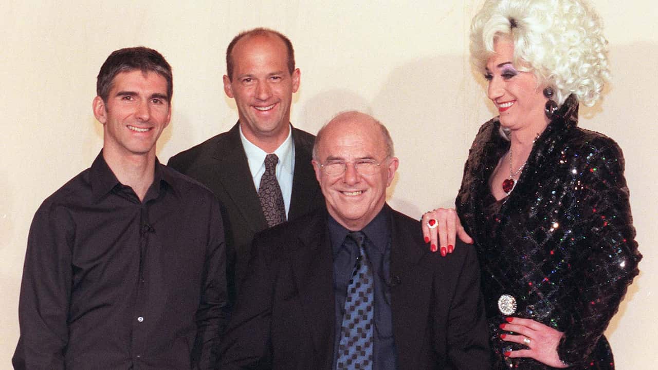 Racing driver Damon Hill, actor Anthony Edwards, and drag queen Lily Savage with Clive James before a recording of his chat show 'Monday Night Clive' in 1999.