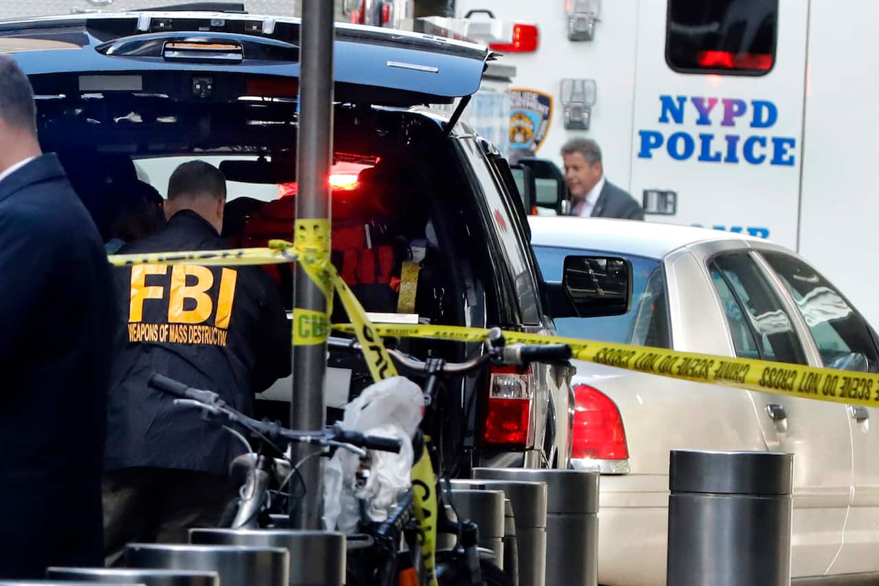 A member of the FBI Weapons of Mass Destruction team works outside the Time Warner Center, in New York. (AP)