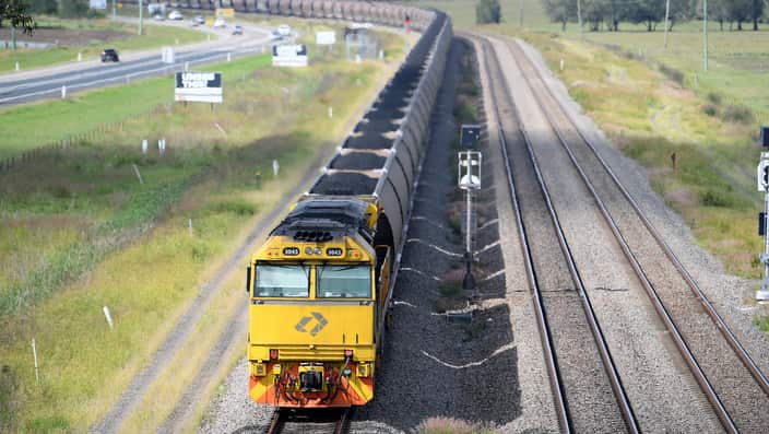 A loaded coal train pass through the outskirts of Singleton, in the NSW Hunter Valley.