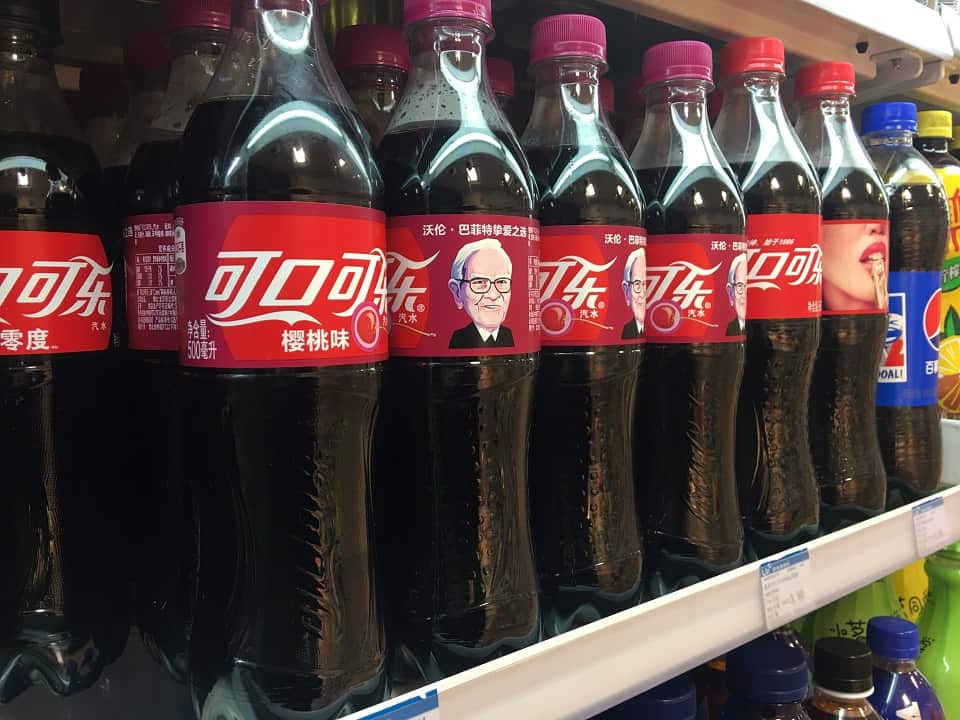 Bottles of Cherry Coca-Cola with a portrait of Warren Buffett, Chairman and CEO of Berkshire Hathaway, are for sale in China.