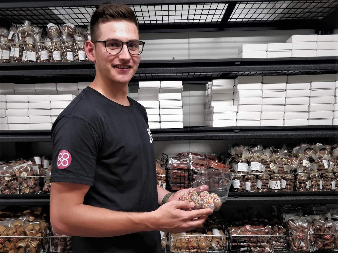 Chris Bertuccio holding their signature coated eggs.