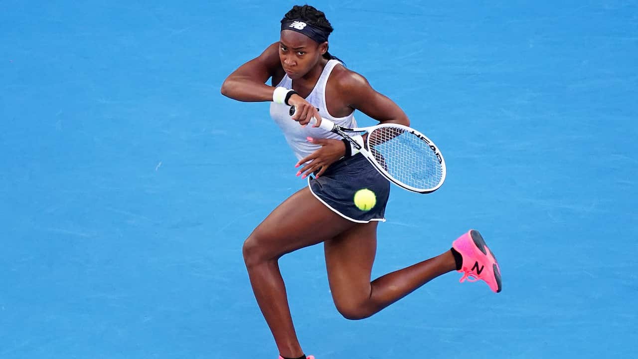 Coco Gauff of the USA returns a shot during her third round match against Naomi Osaka of Japan.