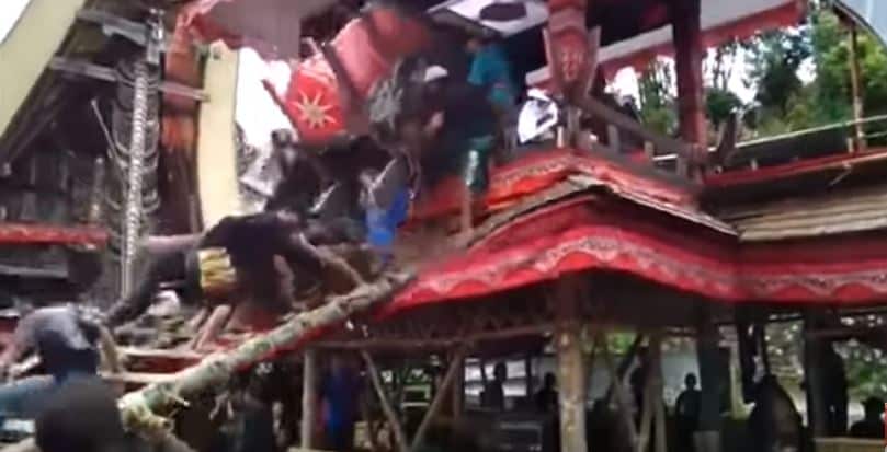 Coffin falling on pallbearers