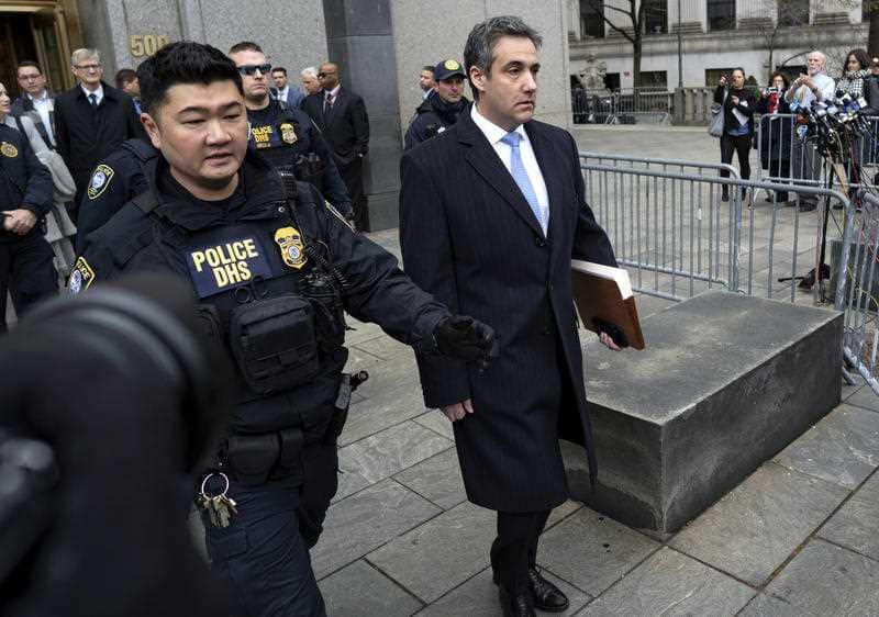 Michael Cohen walks free from court. He'll have to report to jail in March.