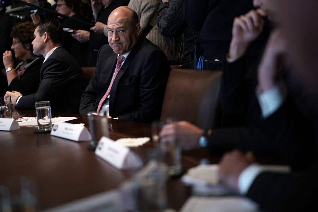 Gary Cohn (C) listens during a meeting between President Donald Trump and congressional members in the Cabinet Room of the White House February 13, 2018.