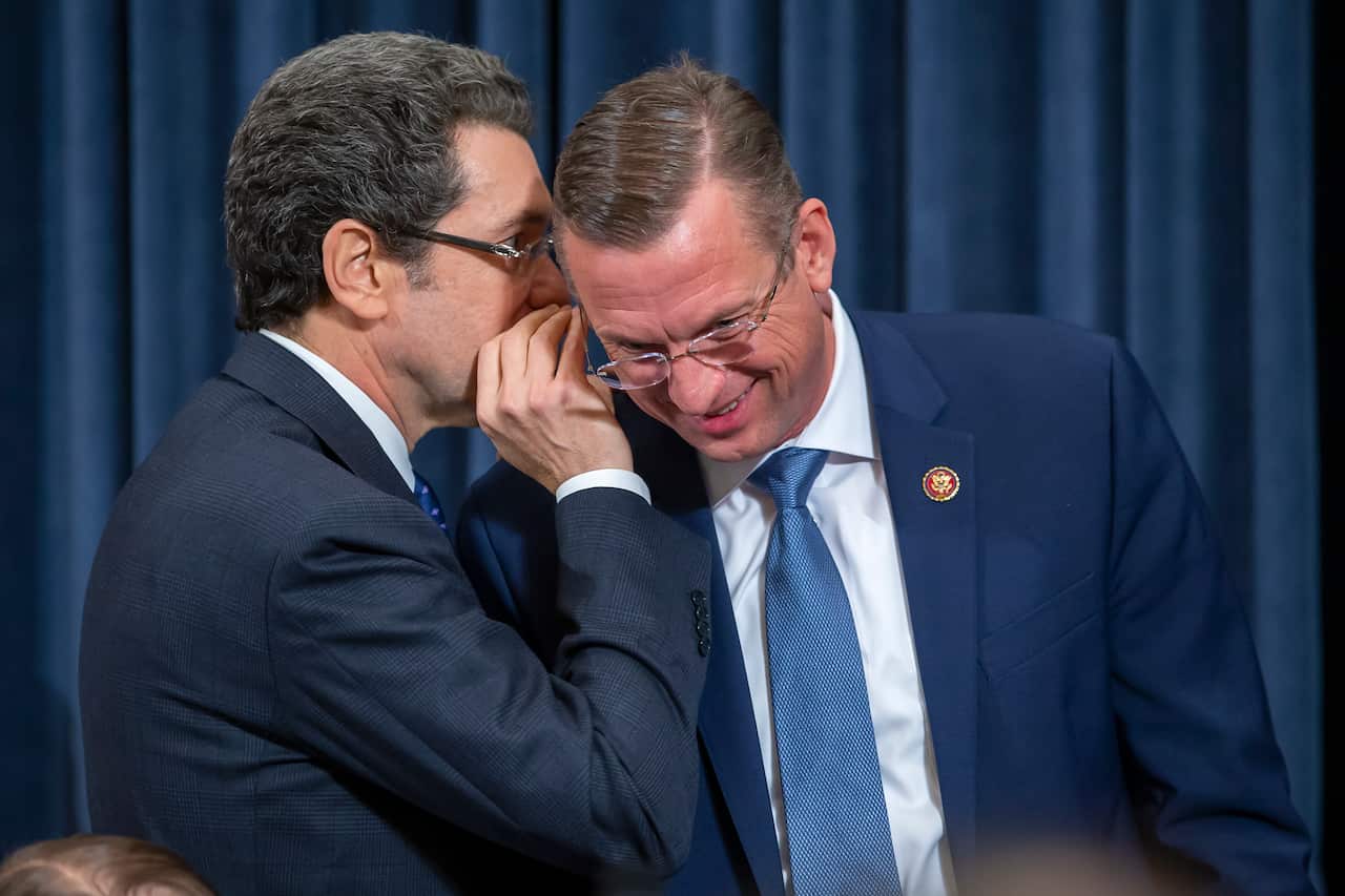 Ranking Republican member Doug Collins (R) of Georgia listens to Democratic counsel Norm Eisen (L) during a break in the US House Judiciary Committee hearing.