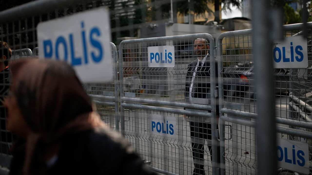 A security guard stands behind barriers blocking the road leading to Saudi Arabia's consulate in Istanbul.