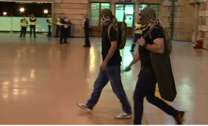 Police playing the part of terrorists, during the operation in Sydney's Central Station. 