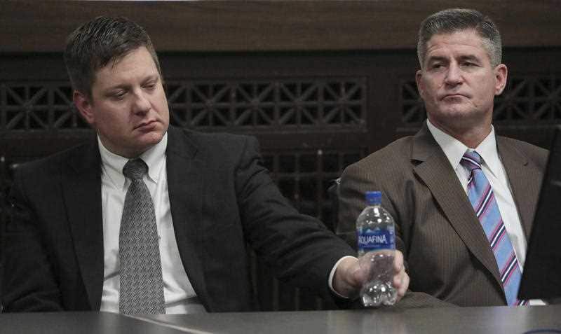 Chicago police Officer Jason Van Dyke and his lead attorney, Daniel Herbert, react after jurors found him guilty of second-degree murder.