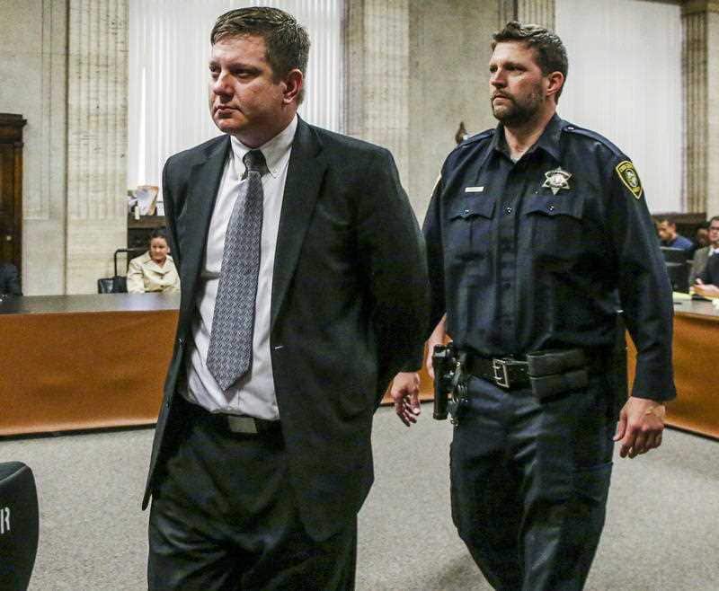 The Chicago officer is led into the courtroom.