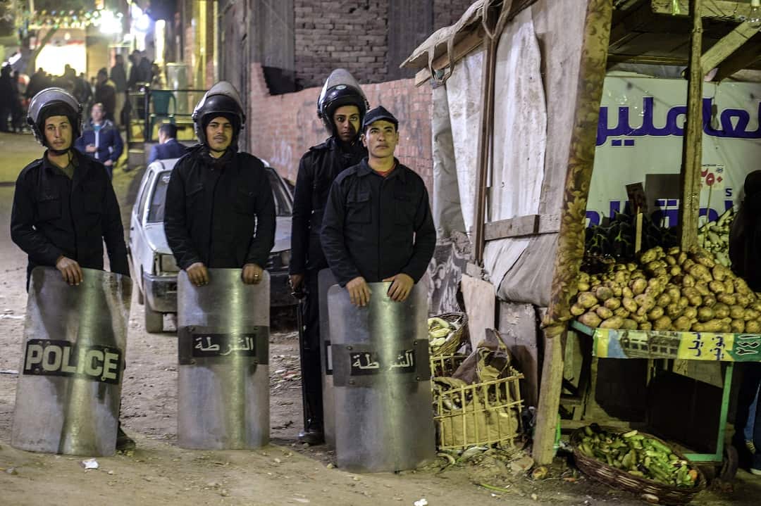 Police guard the area near the church where a bomb exploded.