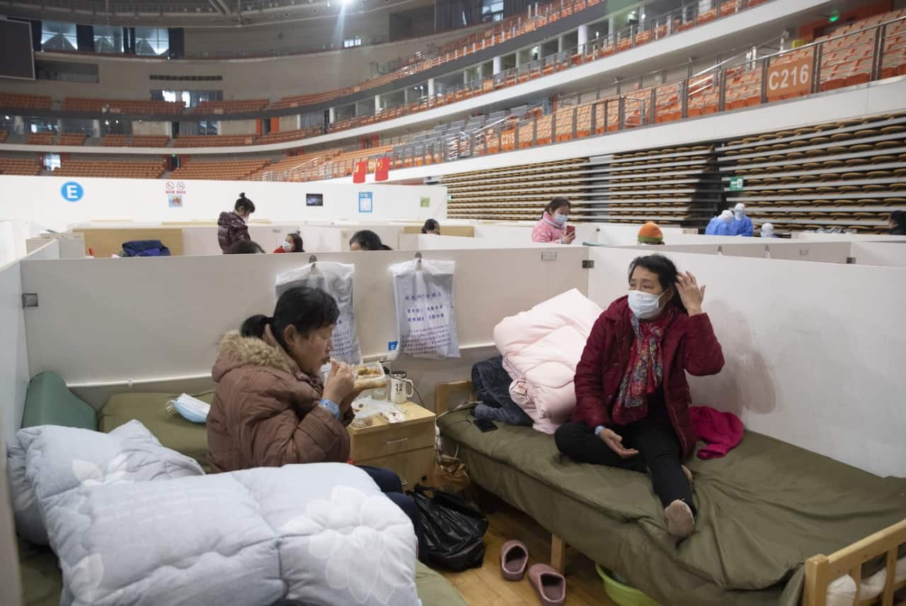 Patients are seen in Wuhan Fangcang hospital, a makeshift hospital to treat Covid-19 patients in Wuhan City