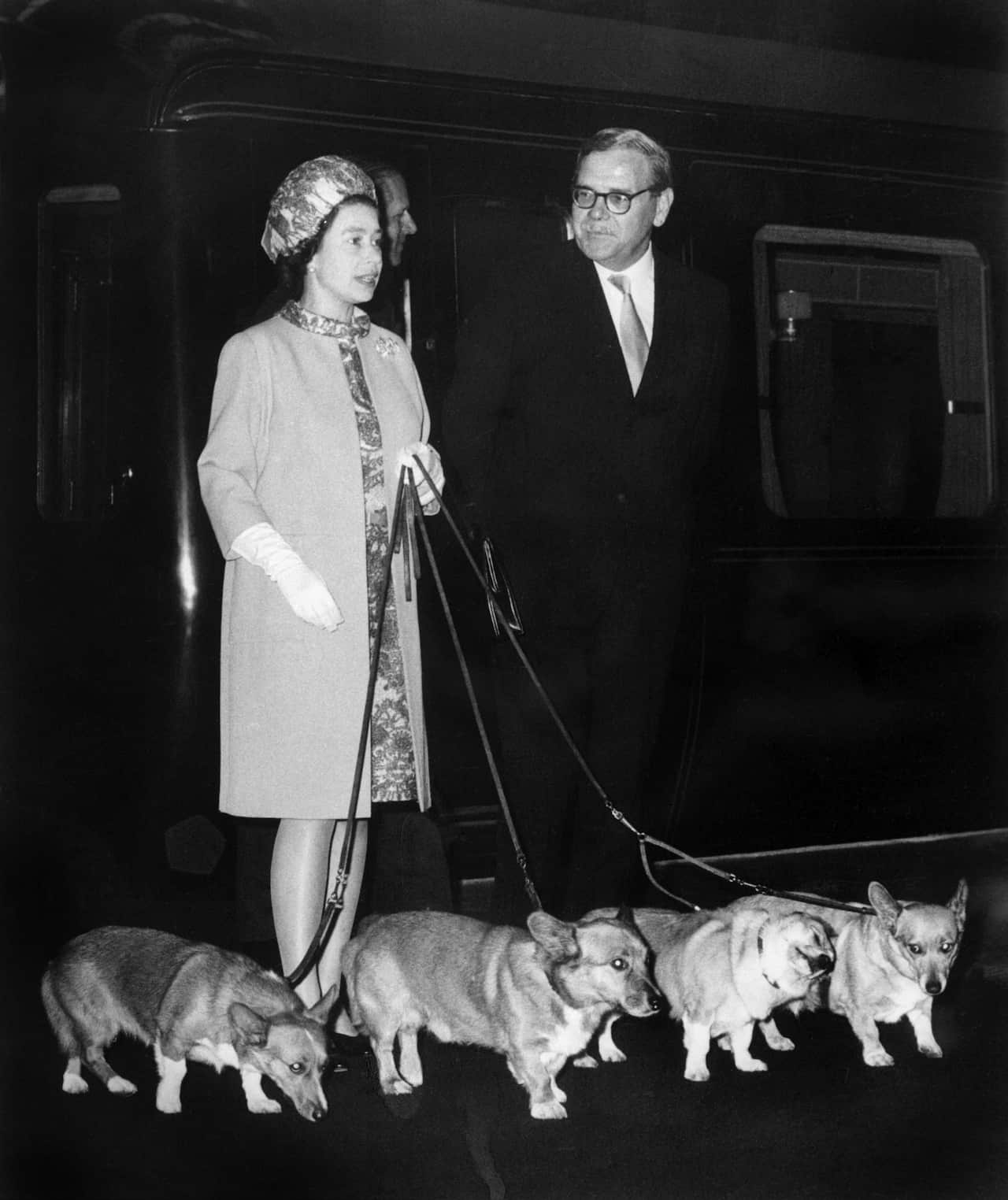 Queen Elizabeth and her Corgis at King's Cross railway station in London, 1969 (Getty)