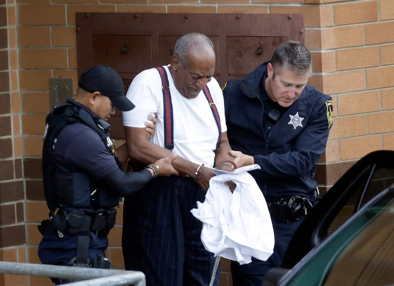 Bill Cosby is escorted out of the Montgomery County Correctional Facility last year have being sentenced to a 10-year-prison sentence.