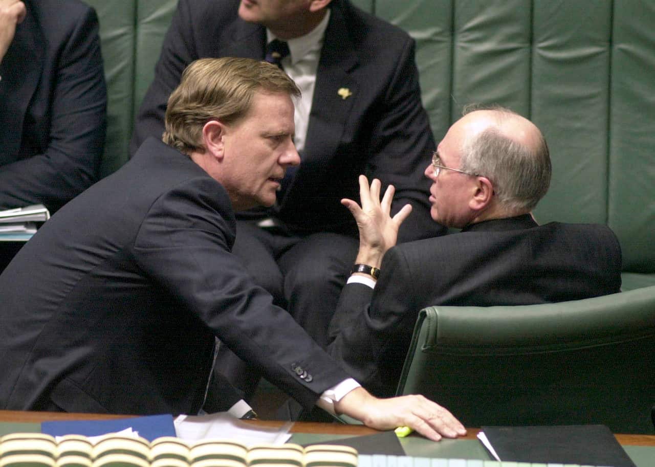Treasurer Peter Costello & PM John Howard during Question Time in the House of Representatives in August 2001. 