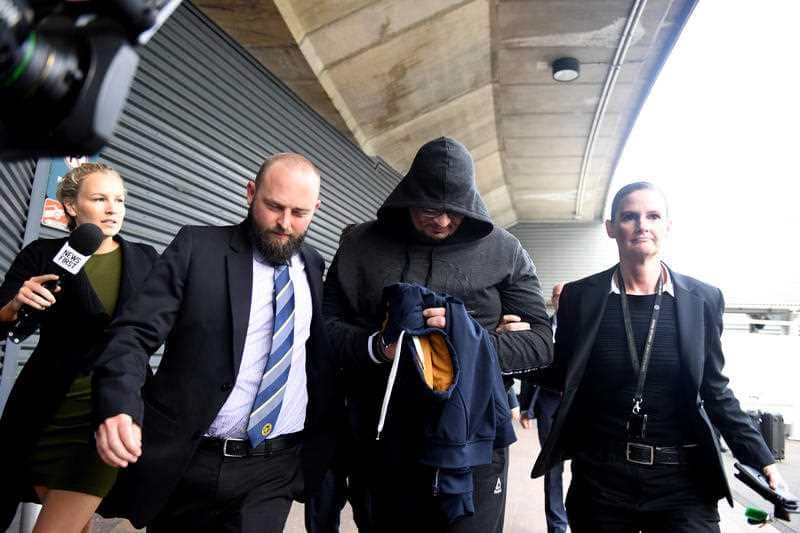 Alex Dion arrives at Sydney International Airport in Sydney. He will face a Sydney court today.