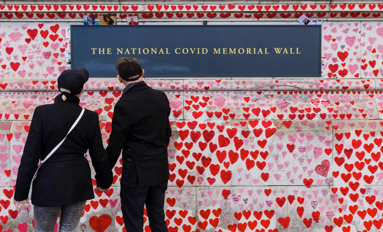 In London, people visit the National COVID Memorial Wall, a tribute to those who died from coronavirus. 