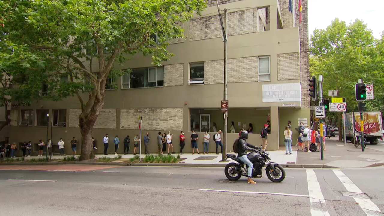 The queue at a COVID-19 testing clinic in Surry Hills, Sydney snaked around the block on Friday.