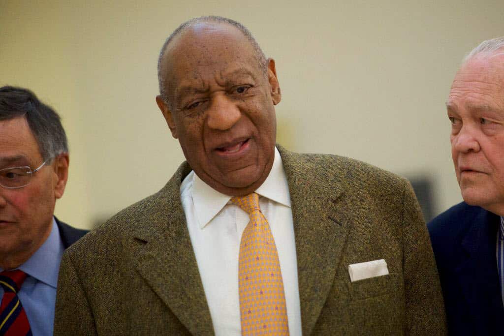 Bill Cosby walks towards the courtroom after a break in the Montgomery County Courthouse.