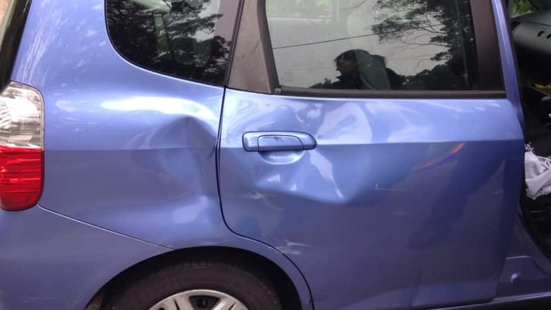 The damage to the car.