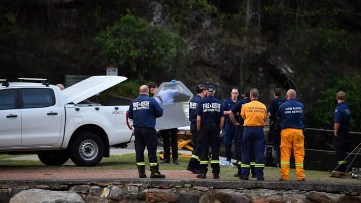 A piece of debris is recovered from a seaplane that crashed into the Hawkesbury River.