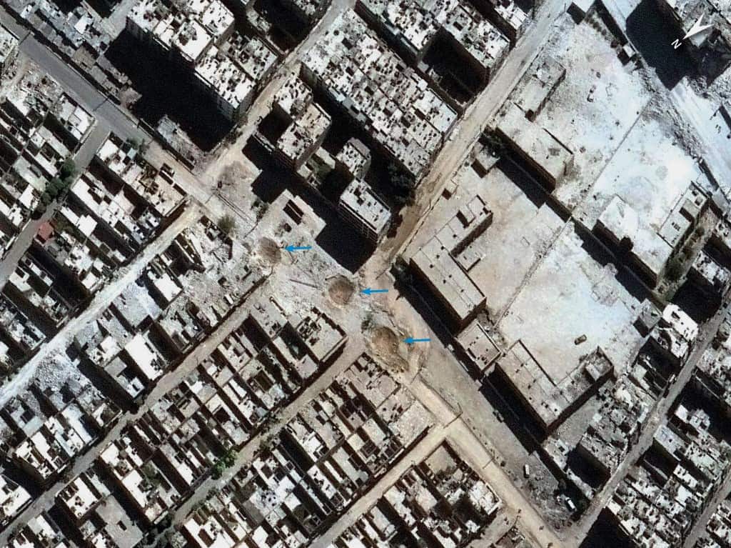 Three craters are shown, in what the group said signified the use of cluster bombers (Amnesty International)
