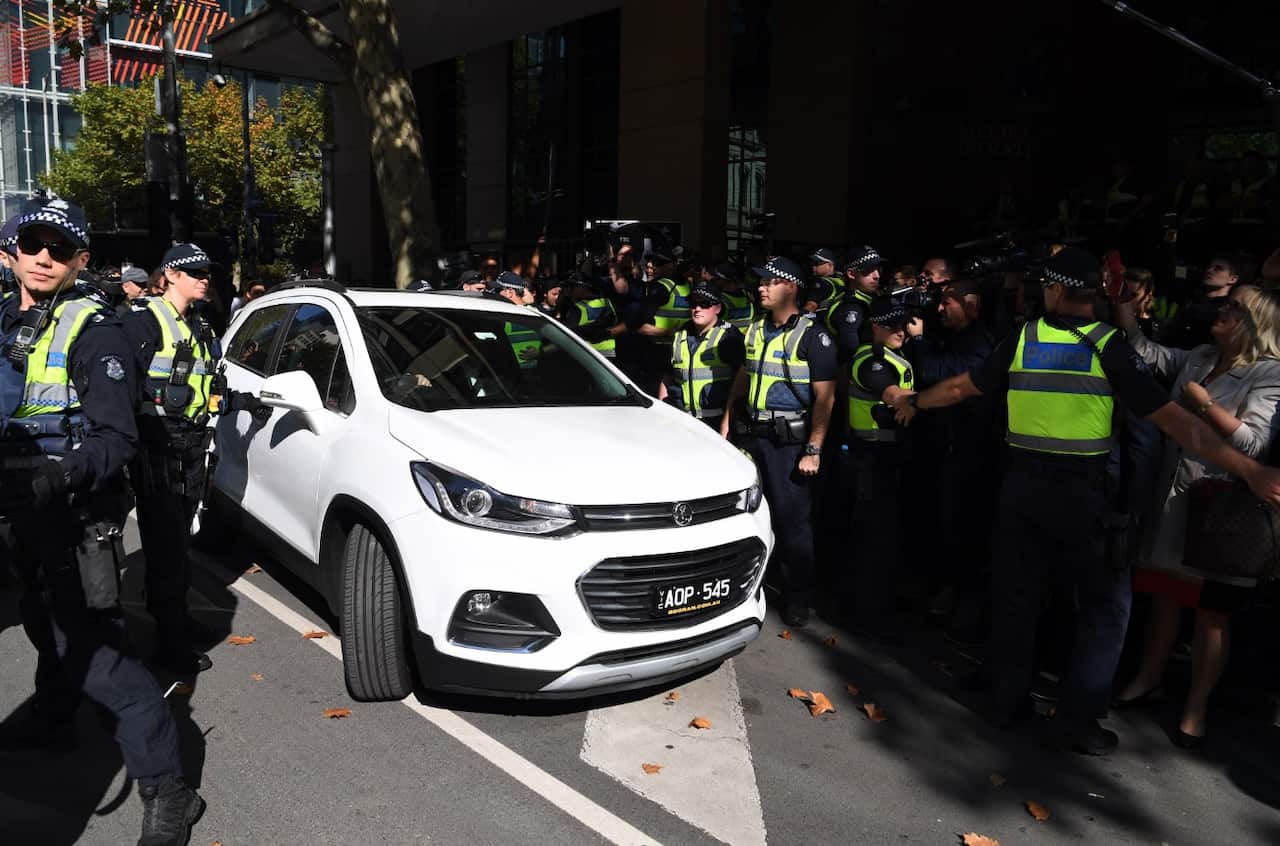 Cardinal George Pell departs the Melbourne Magistrates Court in Melbourne on Tuesday, May 1, 2018. 