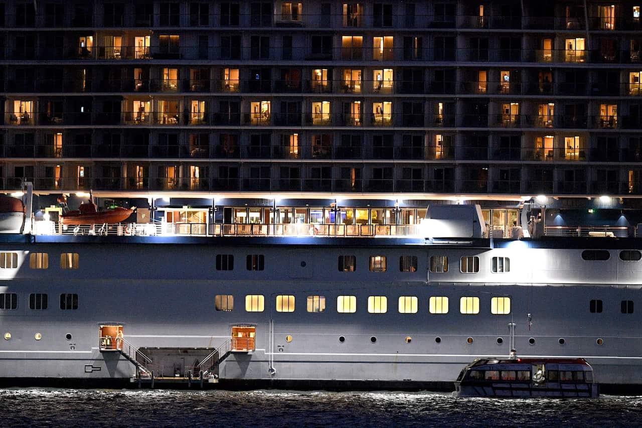 A tender craft approaches the cruise ship Celebrity Solstice in Sydney harbour, 4 April 2020.
