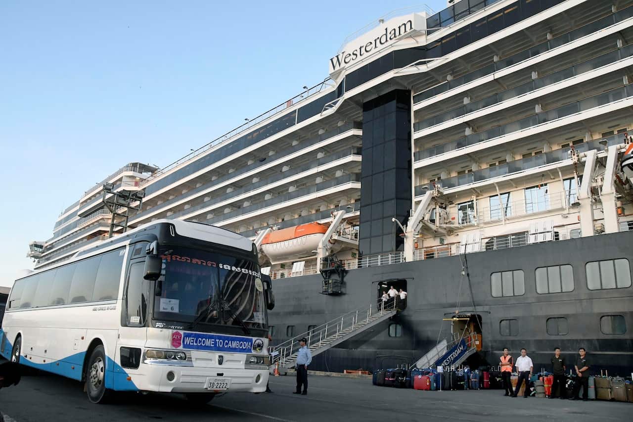A bus waits for passengers to disembark from the Westerdam cruise ship at the port of Sihanoukville in Cambodia.
