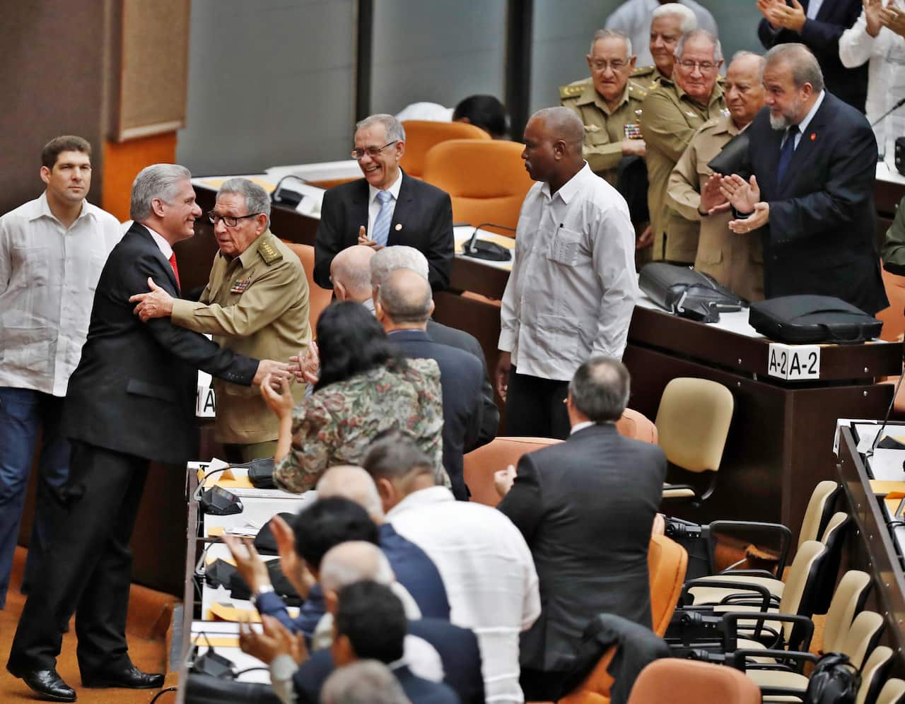 The first secretary of Cuba Communist Party  Raul Castro greets Cuban President Miguel Diaz-Canel.